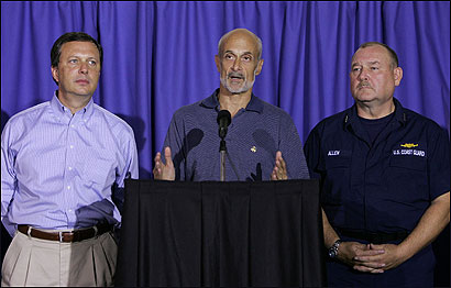 Homeland Security Secretary Michael Chertoff (center) told reporters yesterday of the removal of the FEMA director, Michael D. Brown (left), in managing the Hurricane Katrina relief effort. Coast Guard Vice Admiral Thad W. Allen (right) will now spearhead the effort.