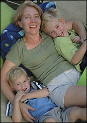 Elena Irwin, a college professor, chose to work part time to spend time with her sons, Elliot (left) and Isaac.
