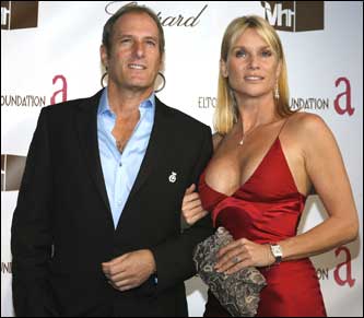 Actress Nicollette Sheridan, right, and singer Michael Bolton arrive at the 14th annual Elton John Academy Awards After-Party