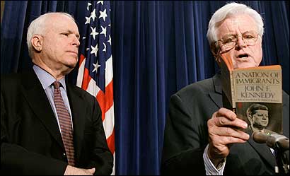 Senator Edward M. Kennedy read from a book on immigration by his brother President Kennedy with Senator John McCain in Washington yesterday.