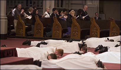 Priests prostrated themselves on the altar of the Cathedral of the Holy Cross last night, as a cantor and choir sang a litany of repentance.