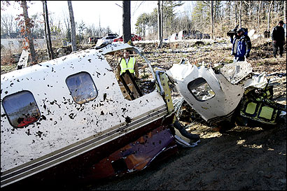 Investigators gathered evidence yesterday at the scene of a fatal plane crash Friday near New Bedford’s airport.