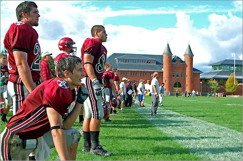 Wesleyan University players exhort their teammates during the football game against Hamilton on the college's campus in Middletown, Conn. Wesleyan is the alma mater of New England Patriots coach Bill Belichick and New York Jets coach Eric Mangini.