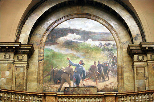 'Concord Bridge April 19, 1775' is one of the murals that ring the top of Memorial Hall in the State House.