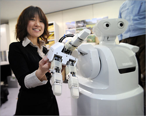 Electronics giant Toshiba introduced a prototype housekeeping robot at the company's laboratory on March 11 in Kasawaki, Japan.