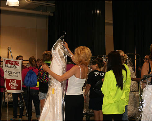 Many were able to sort through the mounds of dresses and check out early.