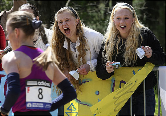 Lauren Strand (left) and her sister Holly of Hampstead, N.H., cheered on the elite women runners.