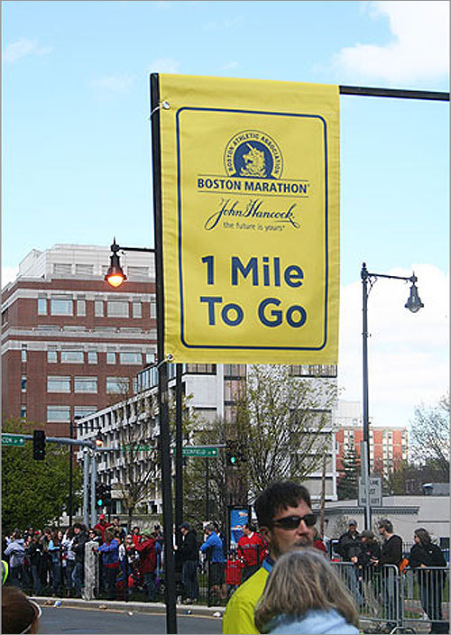 A welcome sight: The 'one mile to go' sign in Kenmore Square.