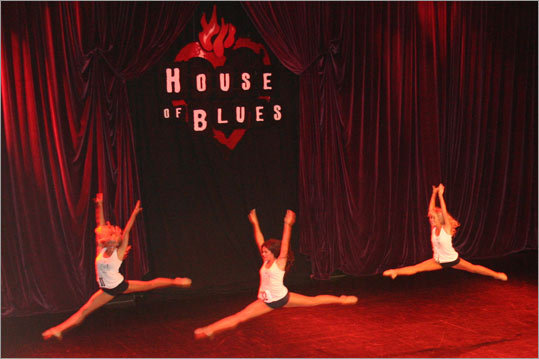 Kate, Michelle, and Meghan performed in-air leaps as part of the group competition segment.