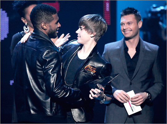 Usher (left) congratulated Justin Bieber