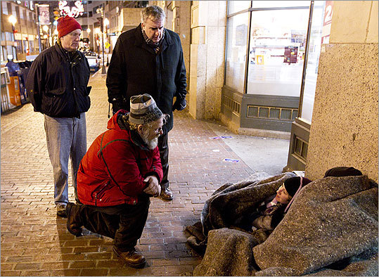 Jim Greene, Director of the Emergency Shelter Commission, knelt to speak to Darrell Noles and his wife Siobban during Boston's annual Homeless Census. Boston Police Commissioner Edward Davis, right, and Michael Durkin, President and CEO of the United Way, looked on.