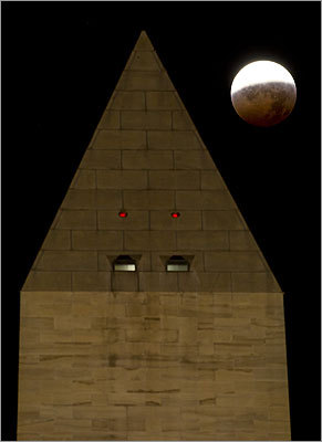 The moon was visible behind the Washington Monument in Washington, D.C., during the middle of the eclipse.