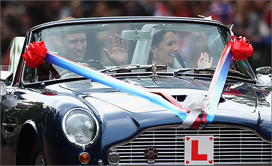 William and Catherine drove away from Buckingham Palace in an Aston Martin convertible.
