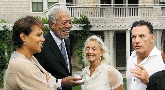 Last night, with the president out of sight, actor Morgan Freeman (second from left) was honored for his work with Plan!t Now, a disaster preparedness organization. A reception for Freeman was held at the West Chop home of lawyer James Ferraro (right). From left: Donna Lee, founder of Plan!t Now, Freeman, poet Rose Styron, and Ferraro.