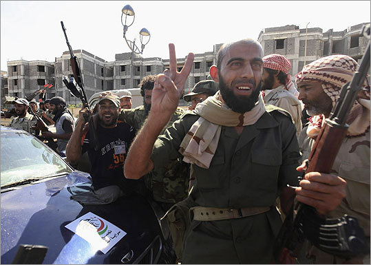 Officials in Libya's transitional government say Moammar Khadafy has been captured and possibly killed in the fall of his hometown of Sirte, but there is no confirmation from the country's most senior leaders. Since the end of 2010, massive waves of protests have quickly spread across countries in North Africa and the Middle East. Some of these demonstrations aim to oust autocratic rulers and others aim to pressure embattled leaders to carry out sweeping reforms. Click through to see more of the unrest in the Arab world. Libyan protesters, left, celebrated the fall of Sirte.