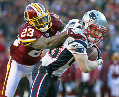 Patriots wide reciever Wes Welker (right) could not be taken down by Redskins CB DeAngelo Hall (left) as he scored the game winning touchdown in the third quarter on a pass from Tom Brady (not pictured). Welker ended the day with seven receptions for 86 yards. Watch video of Welker talking after the game here .