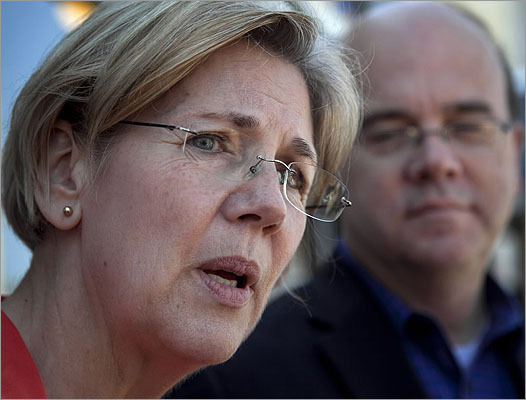 Democratic candidate for U.S. Senate Elizabeth Warren faced reporters during a campaign stop at a diner in Shrewsbury, Mass., April 29, as U.S. Rep. Jim McGovern, D-Mass., looked on.