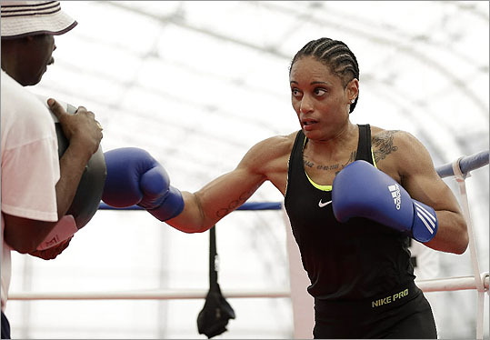 American 60-kg lightweight boxer Queen Underwood warmed up during a women's boxing practice session in London. Women's boxing is an Olympic sport for the first time, taking over the ring for a five-day tournament.