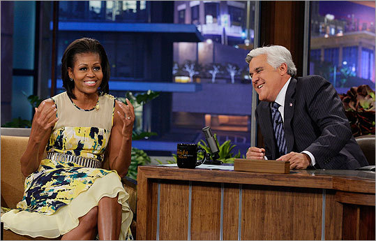 Michelle Obama was bright in a yellow print dress with ruffles during a taping of 'The Tonight Show with Jay Leno' on Aug. 13.