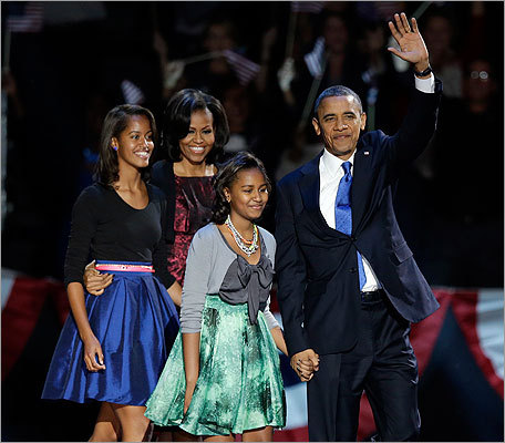 Malia Obama (left) and Sasha Obama also beamed in colorful A-line skirts, wearing electric-blue and an abstract-print green respectively.