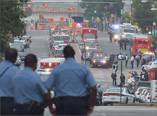 Washington Navy Yard, Washington, D.C. -- Sept. 16, 2013: At least 13 people were killed in a shooting at the Washington Navy Yard, including the 34-year-old gunman Aaron Alexis. Pictures: Scenes at the Washington Navy Yard Pictured: Police and first responder activity on M Street near the Washington Navy Yard.