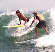 NARRAGANSETT, R.I. : Here's where Rhode Islanders bring their boards to catch a wave; long and flat, the beach is great for combers, too.
