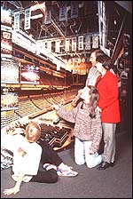 SPRINGFIELD: Visitors examine a photo of Boston Garden at the Basketball Hall of Fame.