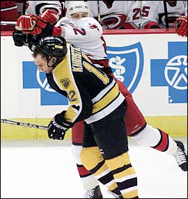 Dimitri Khristich takes a blow to the head