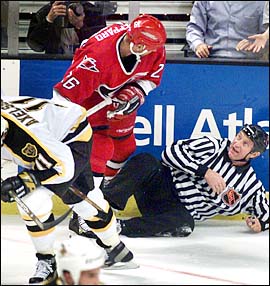 A linesman hits the ice hard
