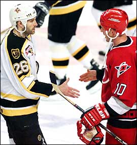 Tim Taylor and Gary Roberts shake hands