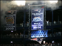 The Super Bowl 2004 banner is unveiled at Gillette Stadium before game the first game of the season between the New England Patriots and Oakland Raiders. (Globe Staff Photo / Jim Davis)