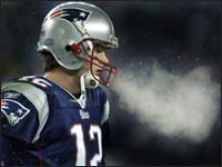 Patriots quarterback Tom Brady exhaled into the very cold night air in Foxboro during New England's 16-3 victory over the New York Jets at Gillette Stadium. (Globe Staff Photo / Jim Davis)