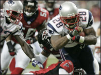 Patriots running back Corey Dillon (28) rushed for a gain during the second quarter of the game against the Atlanta Falcons. The Patriots won 31 to 28 in Atlanta, GA. (Globe Staff Photo / John Bohn)