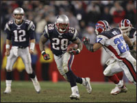 Patriots running back Corey Dillon made a move on Buffalo Bills cornerback Coy Wire during the fourth quarter of the game on October 30, 2005 at Gillette Stadium.  (Globe Staff Photo / Matthew J. Lee)