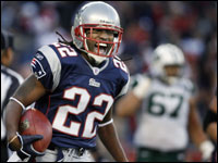  Patriots cornerback Asante Samuel (22) has the ball, as well as a huge smile, following his fourth quarter interception return for a touchdown.  <br> (Globe Staff Photo/Jim Davis)
<p>