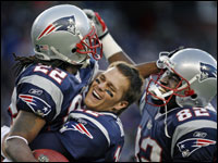 Asante Samuel (left) got a hug and a lift from quarterback Tom Brady (center), and a big smile from tight end Daniel Graham (right) following Samuel's fourth quarter interception.  <br> (Globe Staff Photo/Jim Davis)
<p>