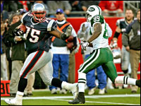Vince Wolfork strikes a runningback's pose as he rumbles and stumbles down the sideline after picking uop a Chad Pennington lateral that went for a fumble in the third quarter.