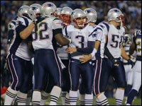 Patriots placekicker Stephen Gostkowski (3) celebrates with teammates as he has just kicked the game winning field goal late in the foruth quarter.