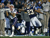 The key play of the game may just have been this long pass reception from Tom Brady (not pictured) to wide reciever Reche Caldwell (left) who beats San Diego cornerback Quentin Jammer (23) and sets up Stephen Gostkowski's game winning field goal.