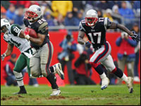 Patriots running back Corey Dillon runs past New York Jets cornerback Andre Dyson enroute to a 50-yard run.