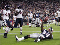  Benjamin Watson (84) celebrates his 4th quarter touchdown reception as teammates Heath Evans (44) and Tom Brady (12) join the jubilation..