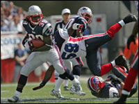  Patriots running back Laurence Maroney cuts back across the grain as Buffalo Bills London Fletcher-Baker fly's past him. 