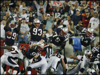 The Patriots missed their first field goal attempt, but a little earlier, the Broncos didn't, despite the synchronized efforts of New England defenders Rosevelt Colvin, Richard Seymour, Vince Wilfork, and Ty Warren.