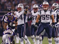  Junior Seau reacted after stopping the Vikings running back Chester Taylor for a short gain.