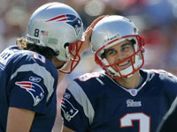  A relieved looking Patriots rookie kicker Stephen Gostkowski (right), gets a pat on the head from holder Josh Miller (left) after he hit the first of his two field goals in the game, a first quarter boot that put New England ahead 3-0.