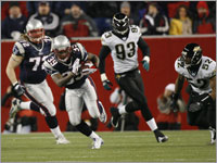 Laurence Maroney breaks away from the Jacksonville defense during the first half of their AFC Divisional Series matchup.