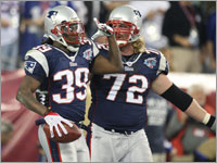 Patriots Laurence Maroney and Matt Light celebrate after Maroney rushed for a touchdown in the first quarter of the Super Bowl.