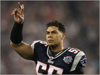 Junior Seau waves to the crowd before the Super Bowl.