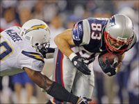 Patriots wide receiver Wes Welker puts his head down for some yards after the catch as Chargers safety Marlon McCree moves in at left in the Patriots' week 2 victory.
