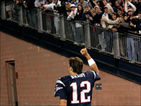 Tom Brady runs off the field to the cheers of the fans at Gillette Stadium.